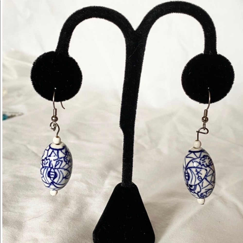 Handmade blue and white oval bead earrings